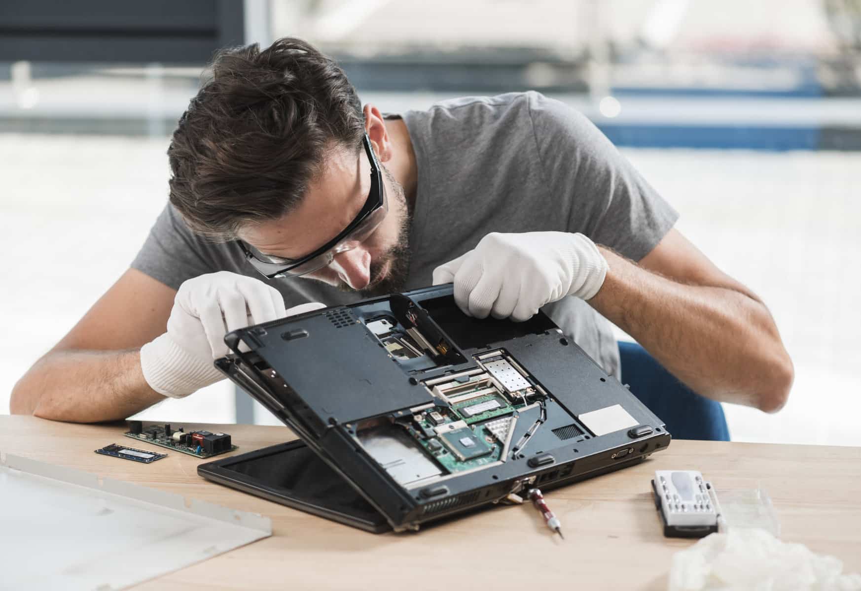 Technician working on laptop